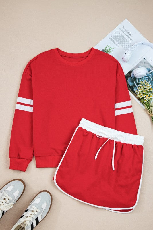 Red pullover sweatshirt and mini skirt set with white striped cuffs and lace drawstring waist