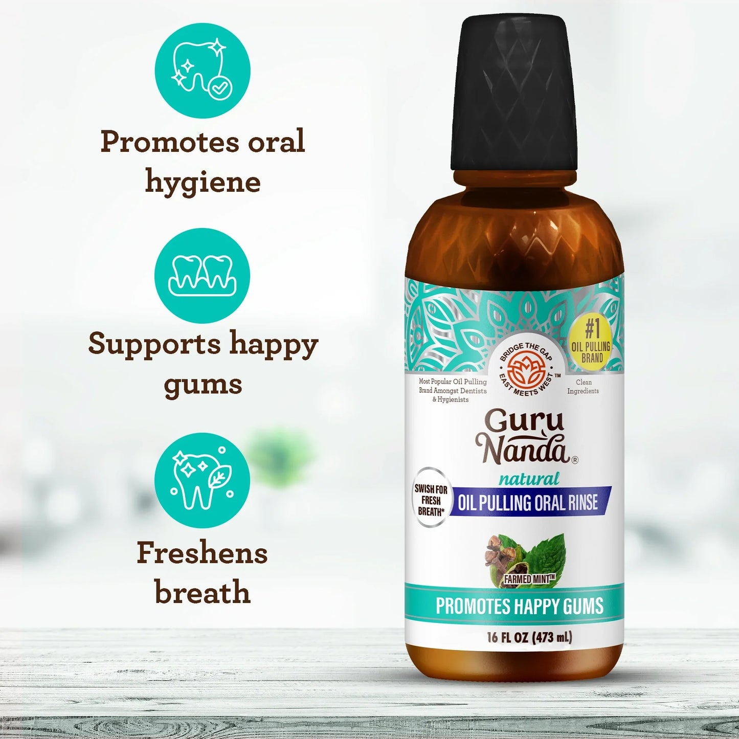 Guru Nanda oil pulling oral rinse bottle with teal patterned label and black cap