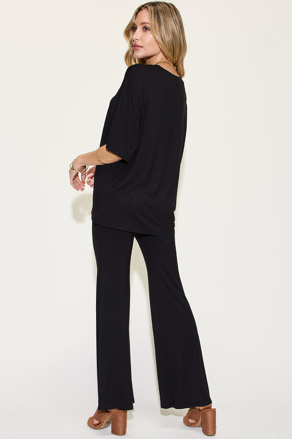 Black back-view drop-shoulder t-shirt and flare pants set with loose short sleeves