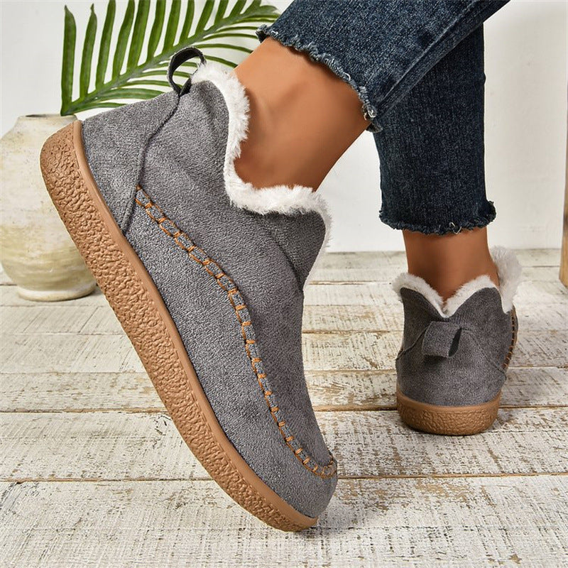 Women’s plush ankle boots in dark grey suede with faux-fur trim, side view