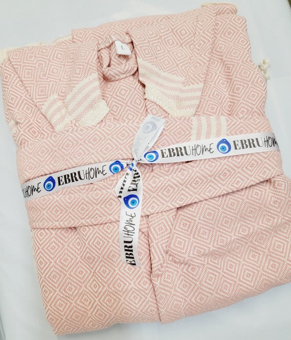 Folded pink robe with EBRUHOM EBRUHO ME tags on label band