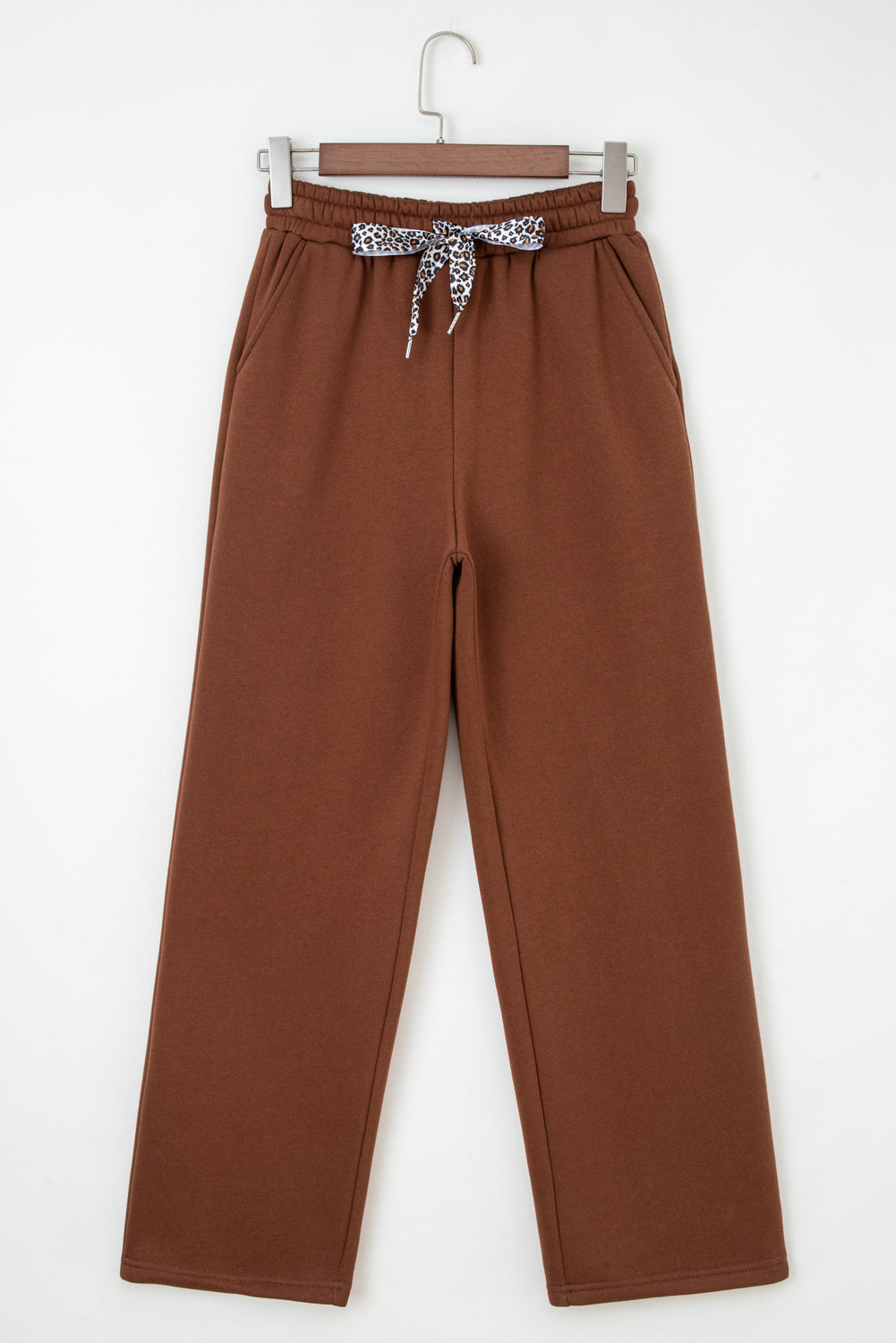 Coffee-brown solid pants with elastic waistband, drawstring bow and wide legs