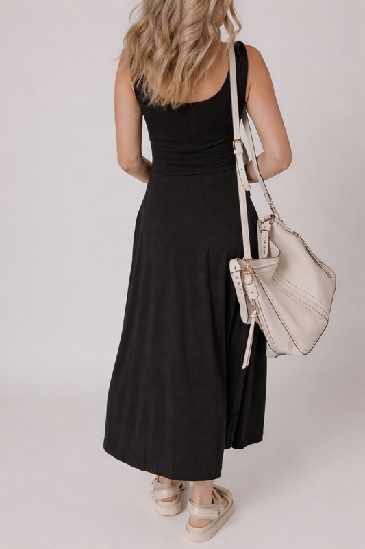 Black sleeveless flared midi dress with scooped back and fitted waist seam