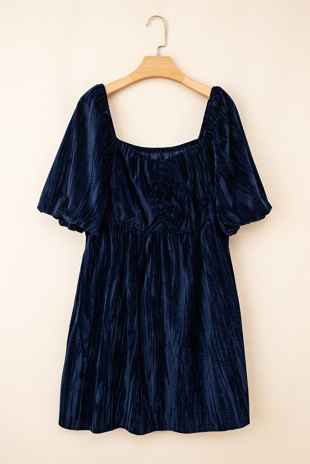 Navy blue short dress on hanger with puff sleeves and square neckline