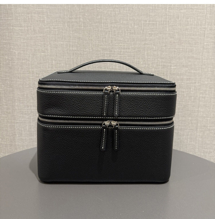 Black leather-look jewelry storage tote with double zipper compartments and handle