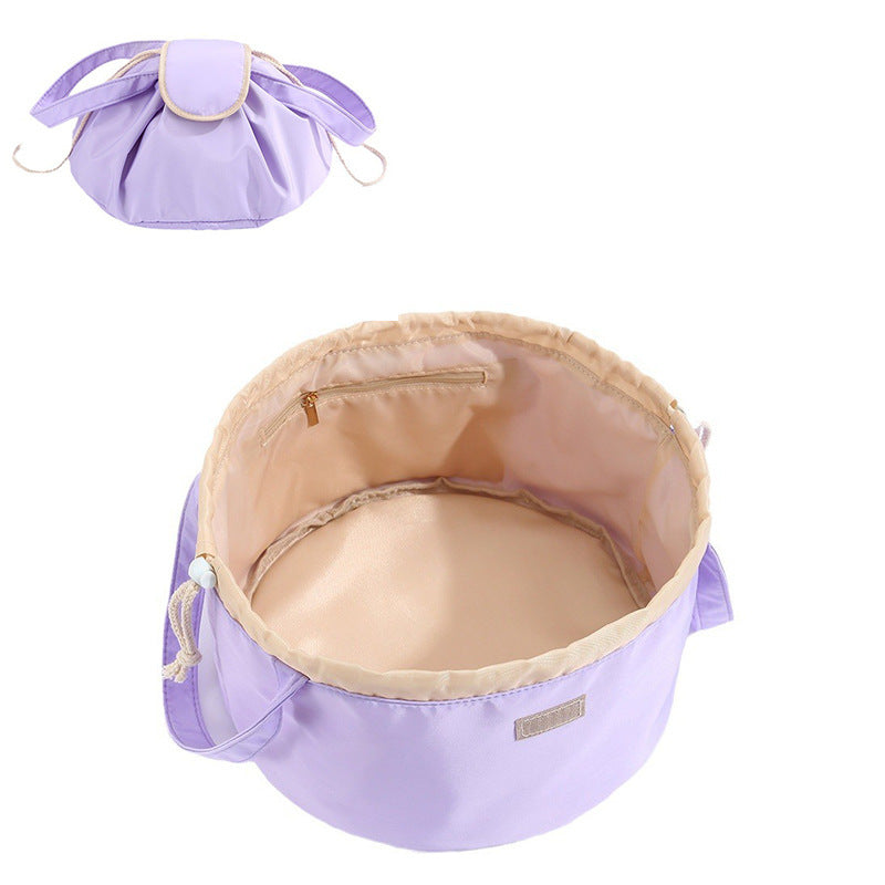 Light purple barrel drawstring makeup bag with top zipper and cord pull handles