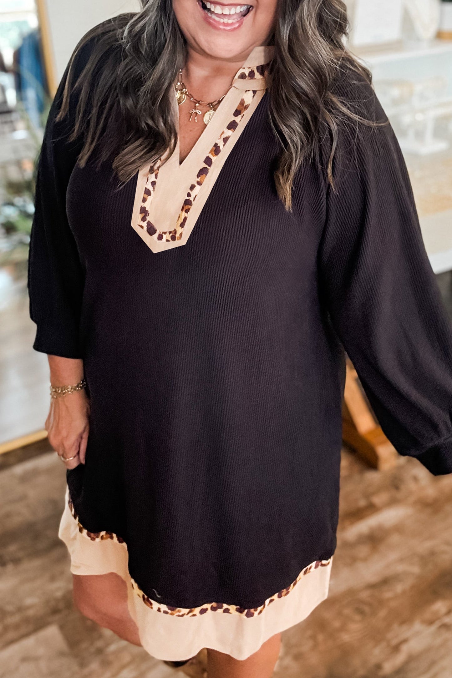 Black PLUS dress with V-neck embroidery and cream contrast hem border, 3/4 sleeve length