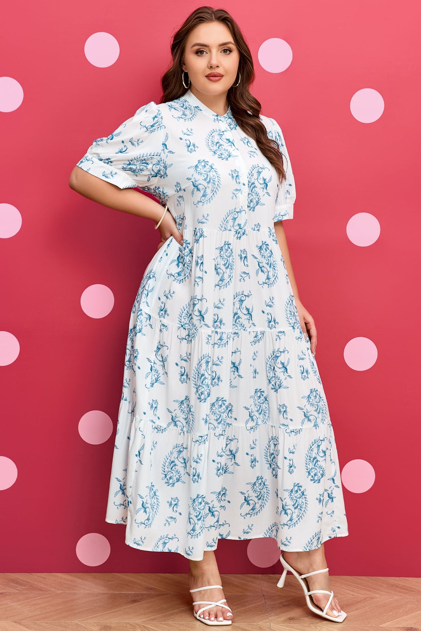 Sky-blue floral maxi dress with short sleeves, gathered bodice, and flowing tiered skirt