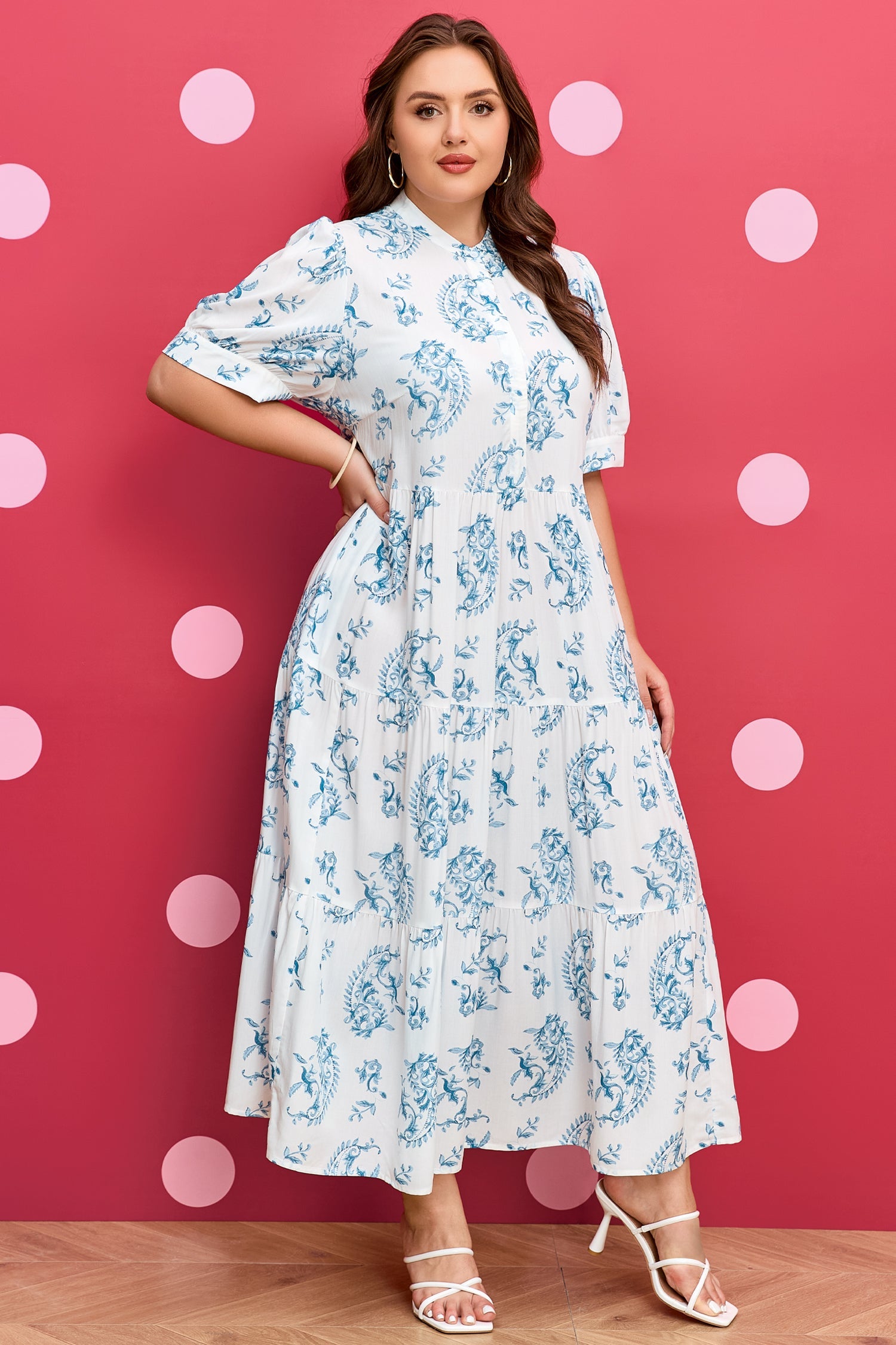 Sky-blue floral maxi dress with short sleeves, gathered bodice, and flowing tiered skirt