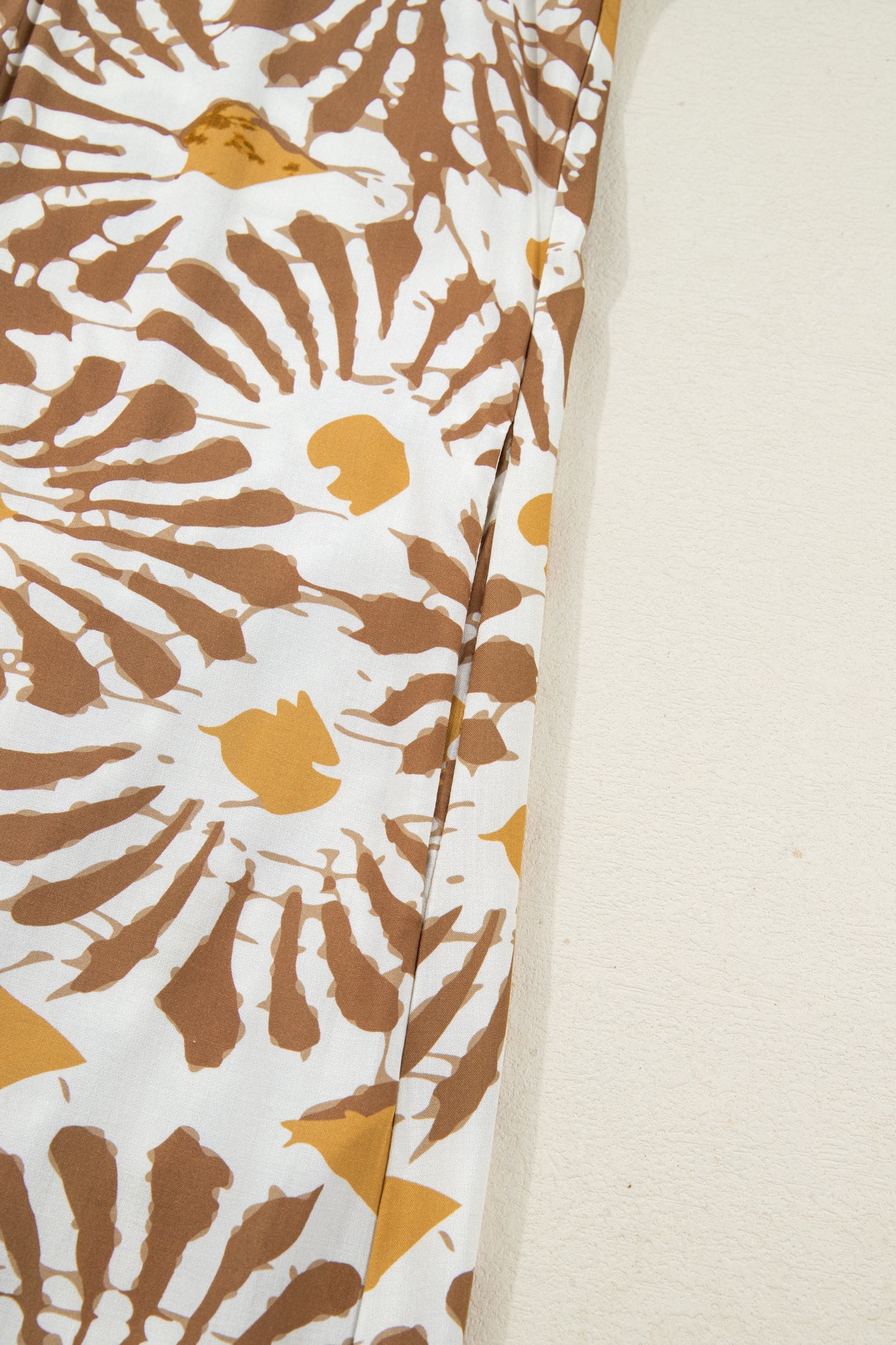 Loose long plus dress skirt panel with tan-and-white abstract print, straight side seam.