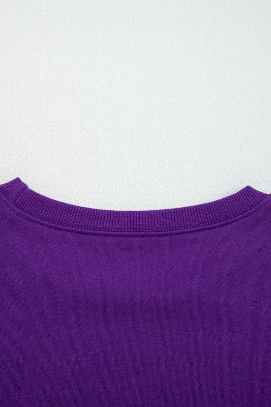 Purple crewneck pullover neckline with ribbed trim