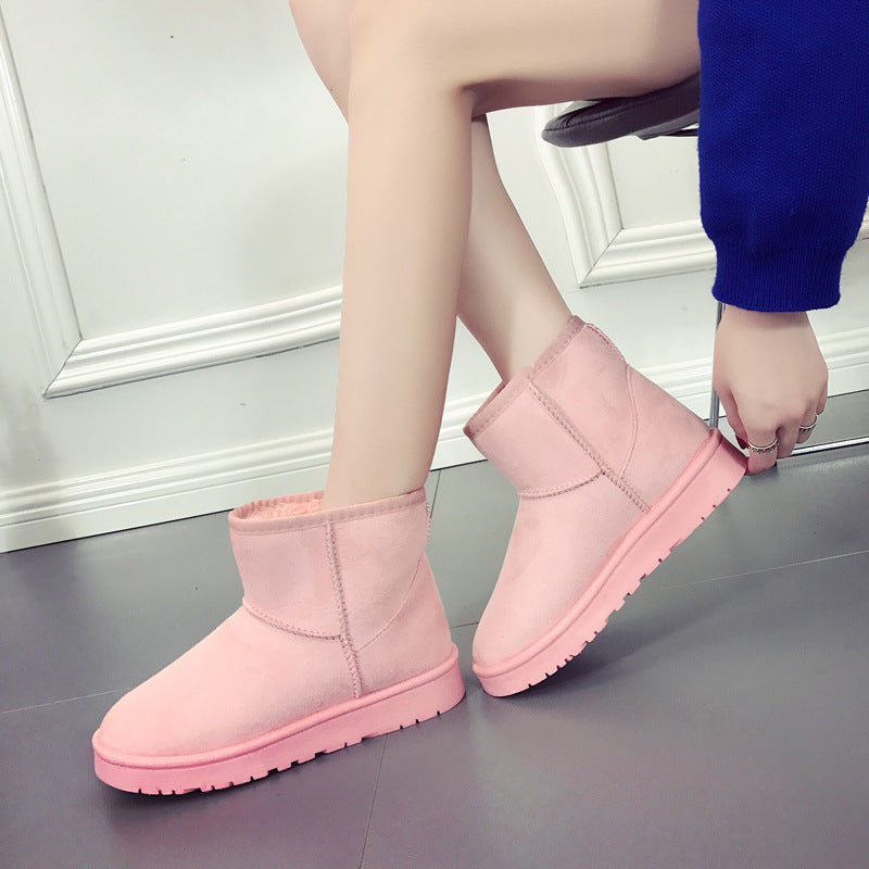Pink winter snow boots with faux-fur lining, slip-on ankle height and rubber sole
