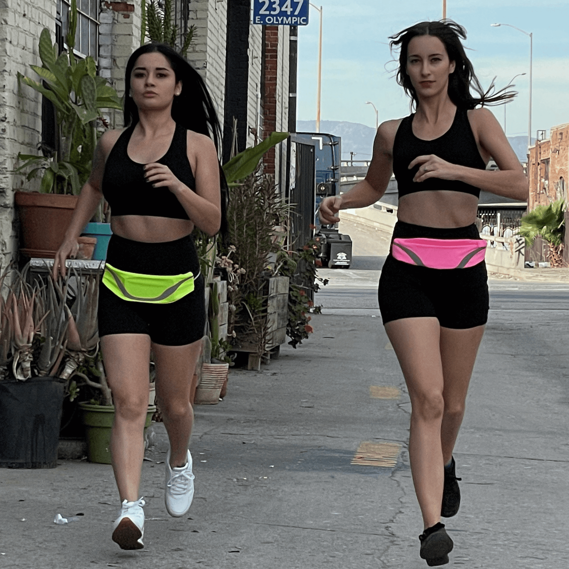 Water-resistant sport waist pack with neon green reflective stripe, worn around the waist.