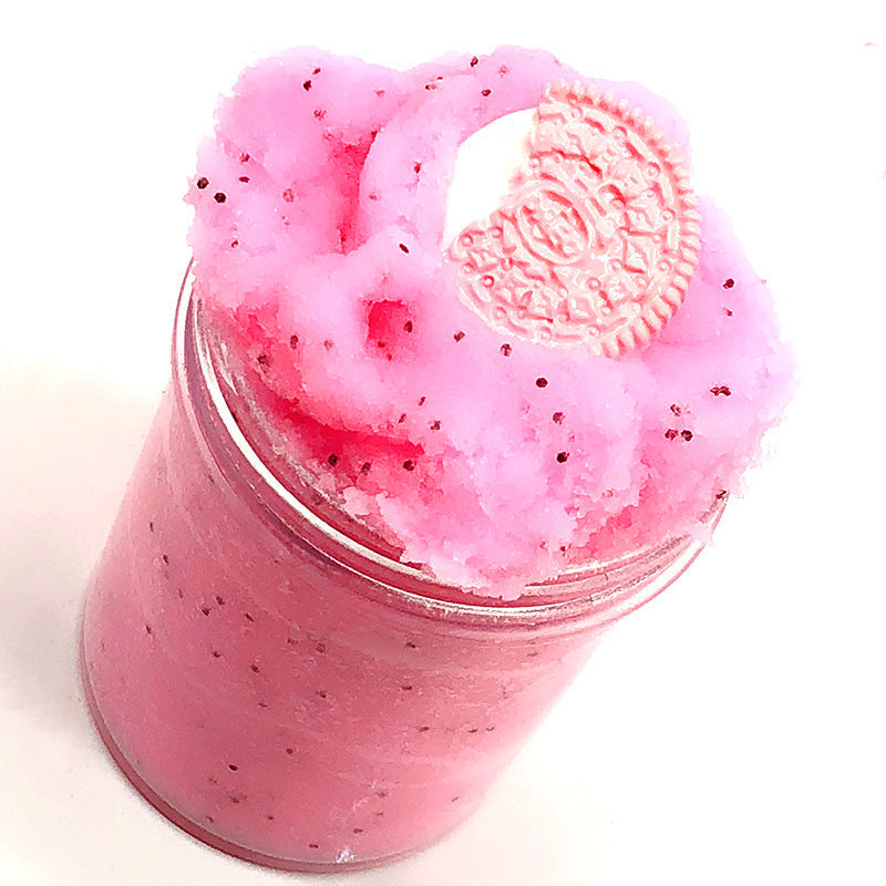 Pink slime cup with heart-shaped embossed topper and fine dark speckles