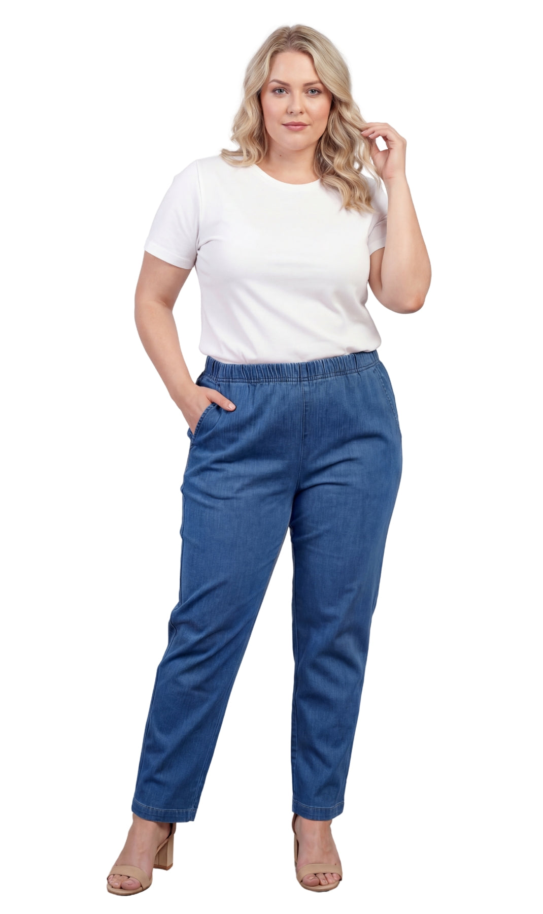 Woman wearing a white top and blue jeans on a white background