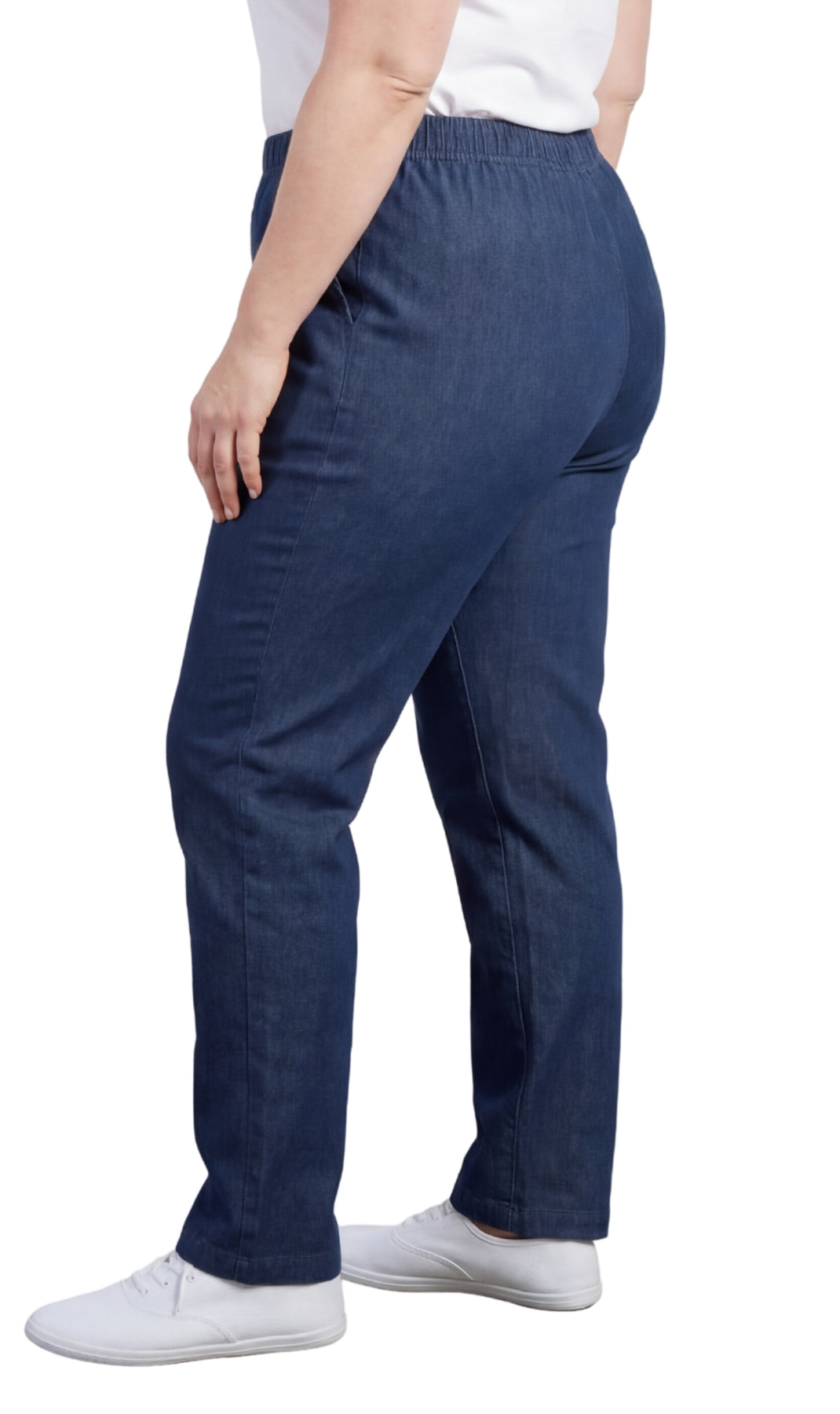 Person wearing blue pants and white shoes on a white background