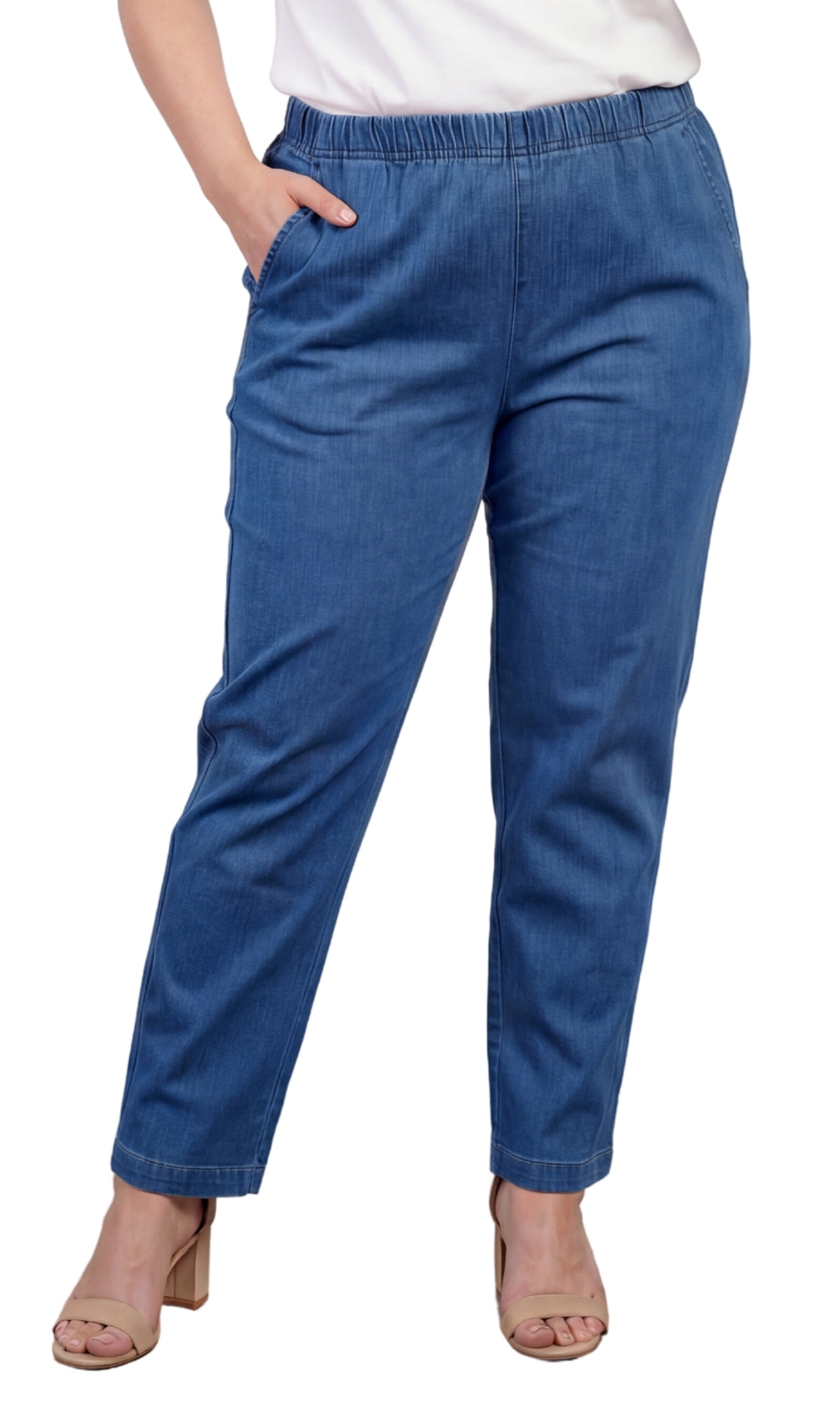 Blue pants worn by a person on a white background