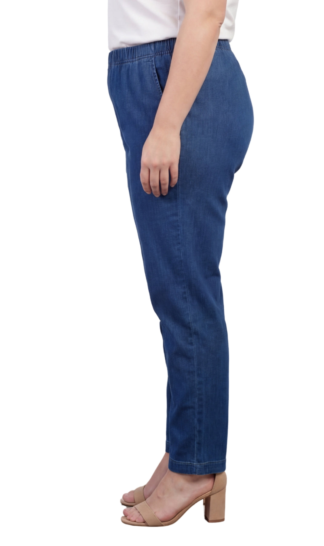Blue jeans worn by a person on a white background