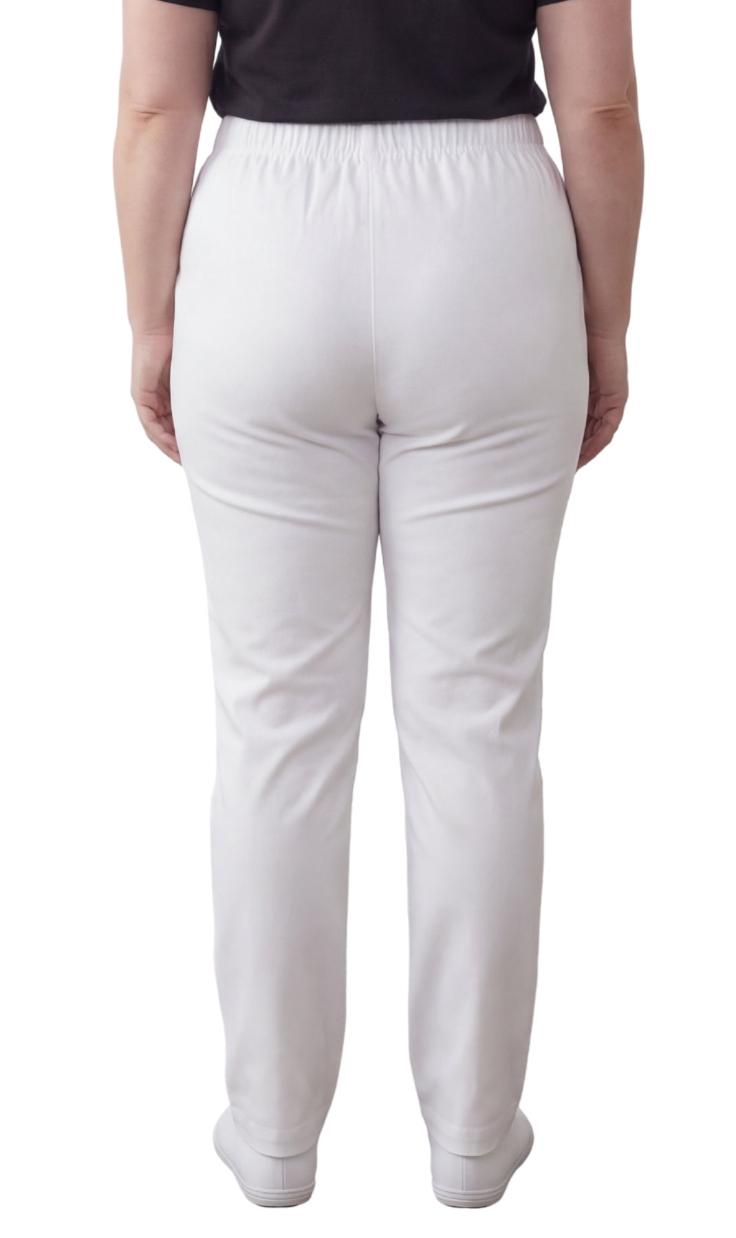 White pants worn by a person on a white background