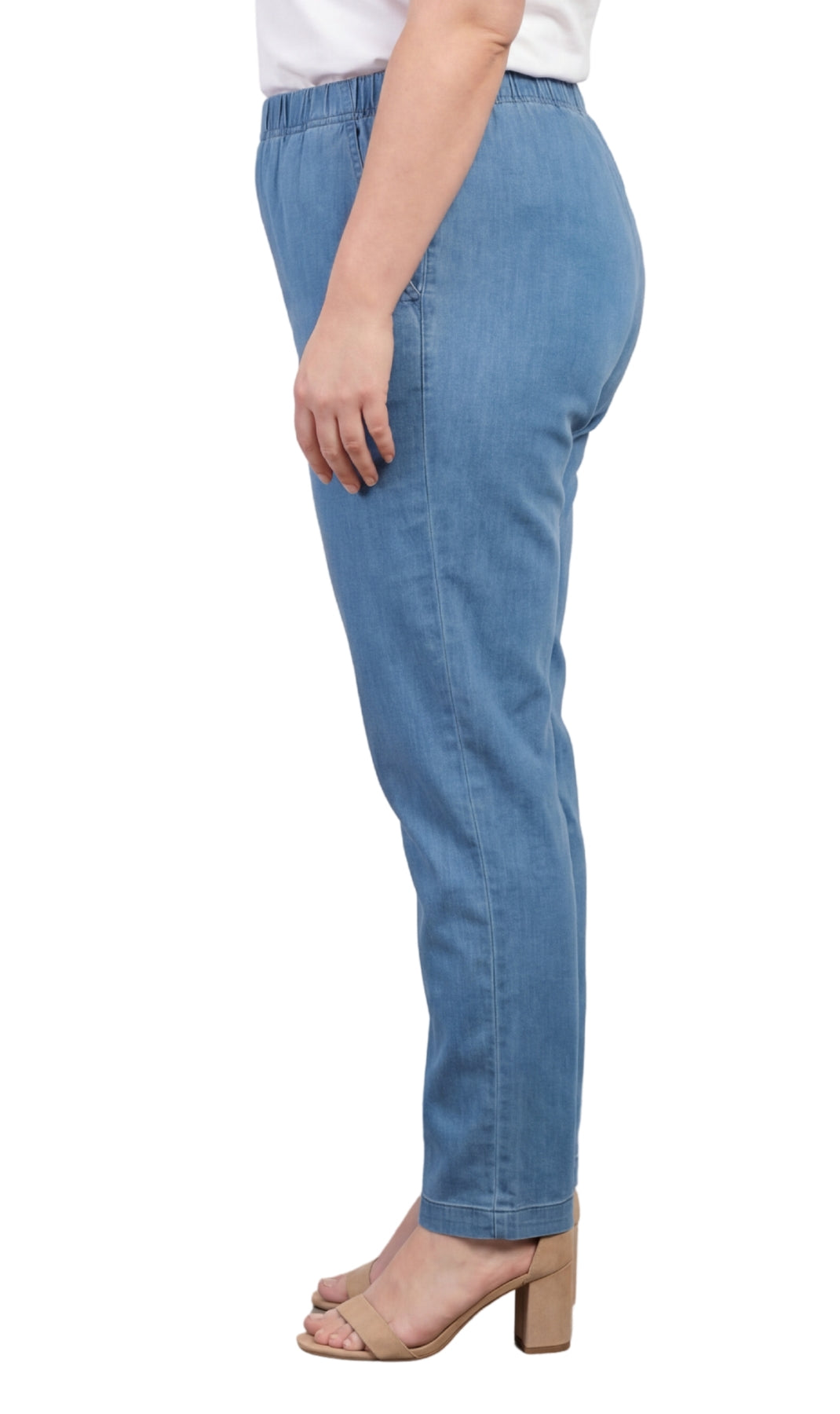 Light blue jeans worn by a person on a white background