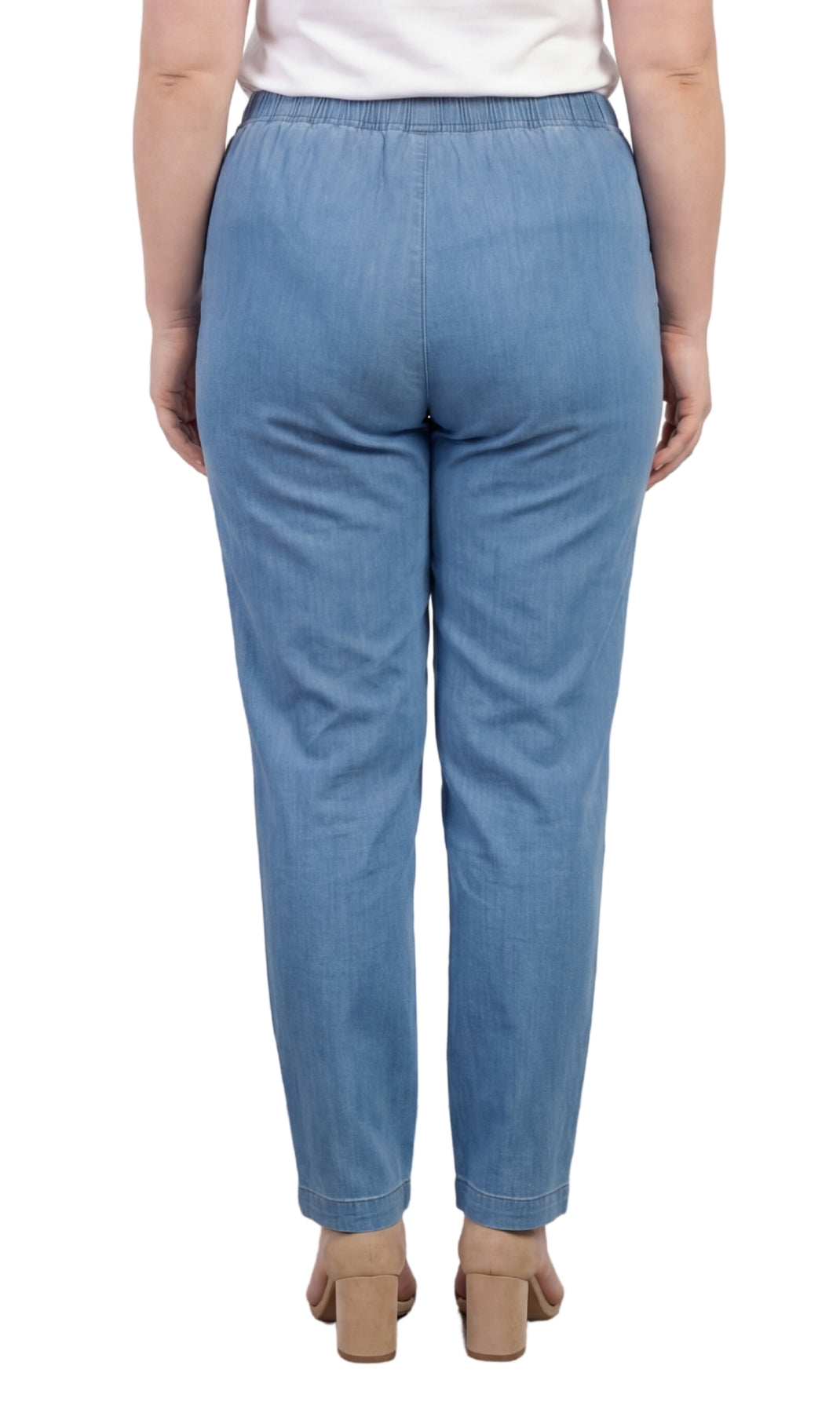 Light blue jeans worn by a person on a white background