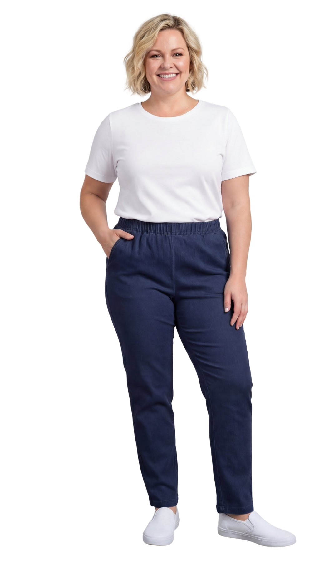 Woman wearing navy pants and a white shirt on a white background