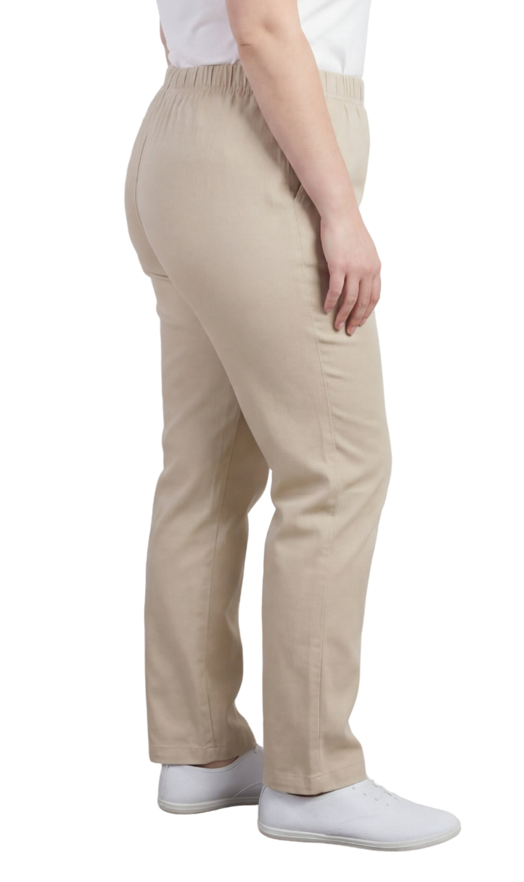 Beige pants worn by a person on a white background