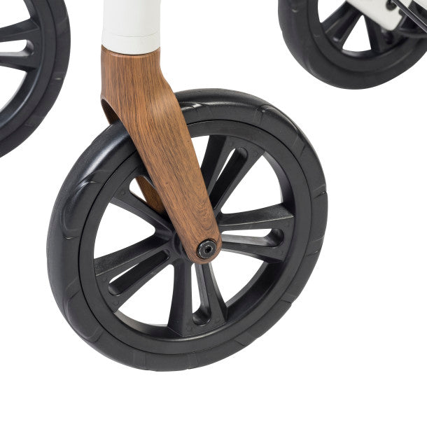 Black caster wheel with wooden spoke accents on a white rollator frame