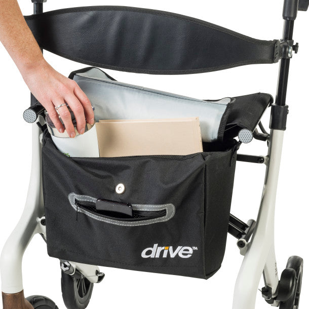 Black front carry pouch open with items inside, attached to white rollator