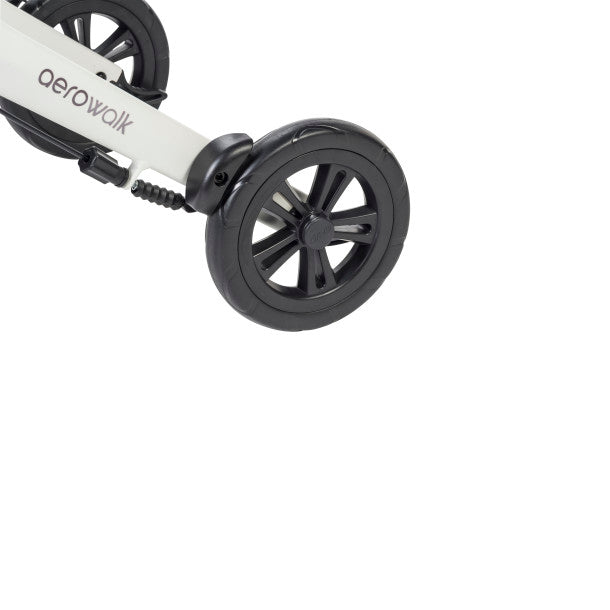 Front wheel and white fork on black rollator with treaded caster tire