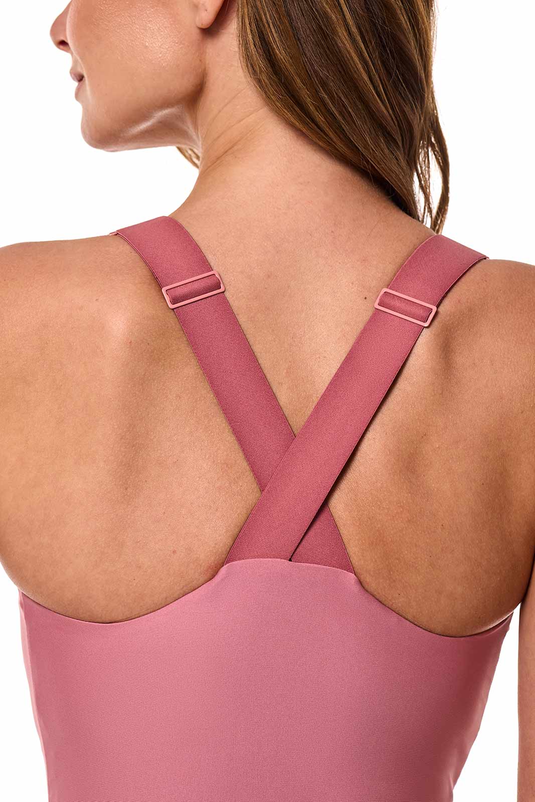 Close-up of women’s mauve pink swimsuit with crisscross back and adjustable shoulder straps
