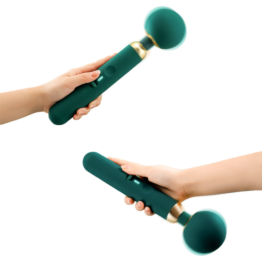 App-controlled massage wand in hand, dark teal body with round silicone head