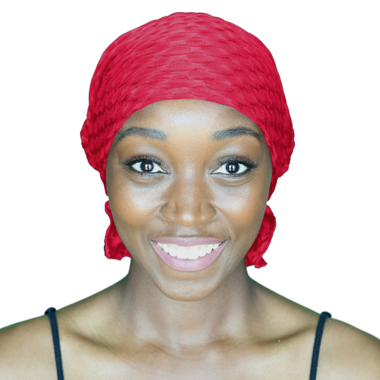 Red chemo beanie with textured knit, wrapped fit and small side tail