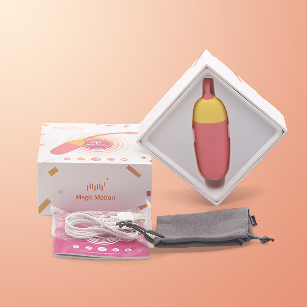 Pink and yellow loop-handled silicone massager in a retail box set