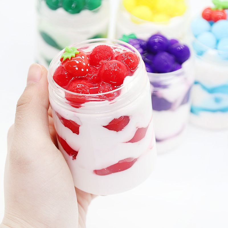 White slime cup with red jelly chunks and heart-shaped candy pieces