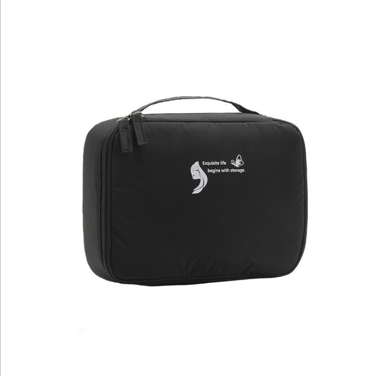 Black square waterproof makeup/toiletry bag with zippered top and carrying handle.