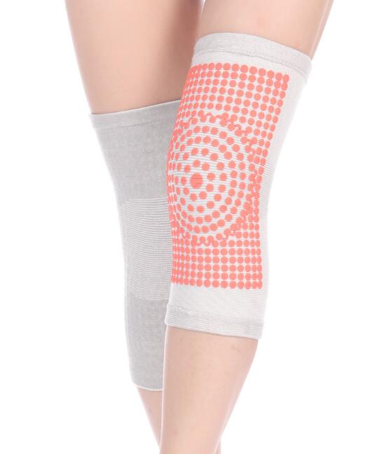 Light grey self-heating knit knee pad with red dot heat grid panel