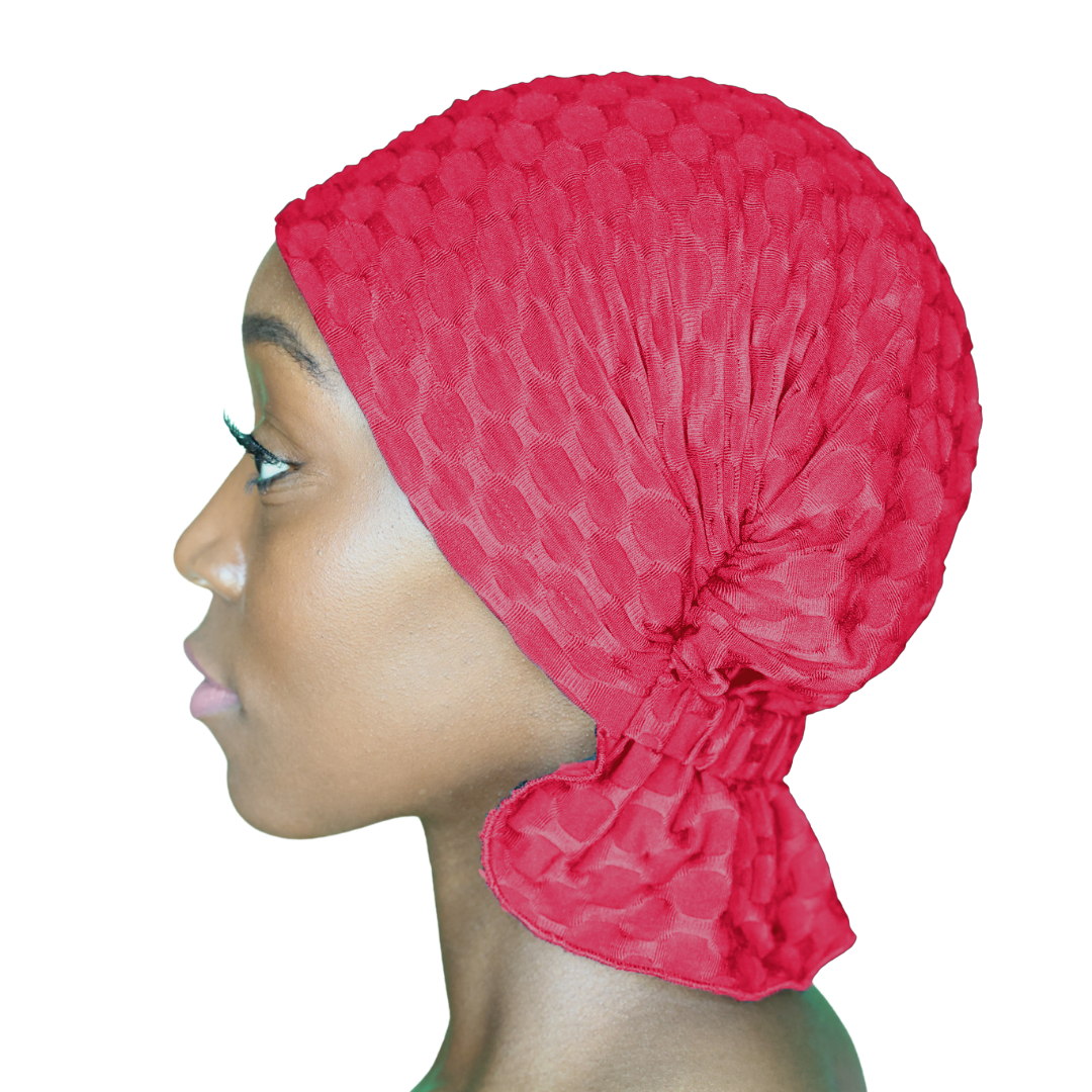 Red chemo beanie with textured knit and gathered side drape