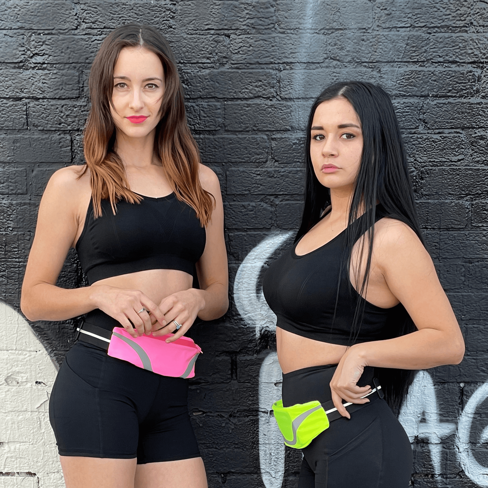 Water-resistant sport waist pack set: pink and neon yellow reflective stripes on waists.