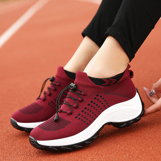 Women’s athletic knit sneaker in burgundy with blue-green perforation and white sole