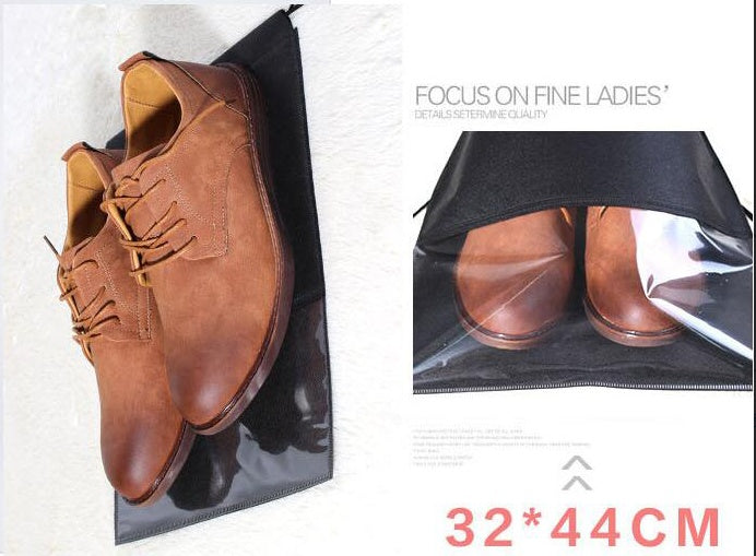 Black drawstring shoe storage bag with clear window, holding brown shoes.