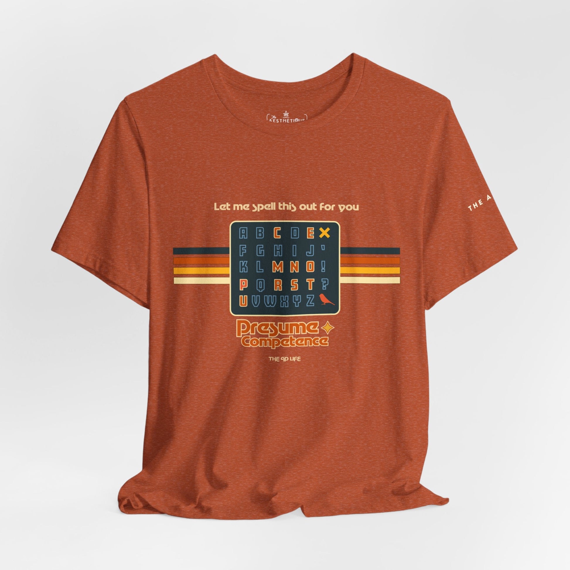 Heather rust unisex jersey tee with spelling-themed letter grid graphic on front, centered