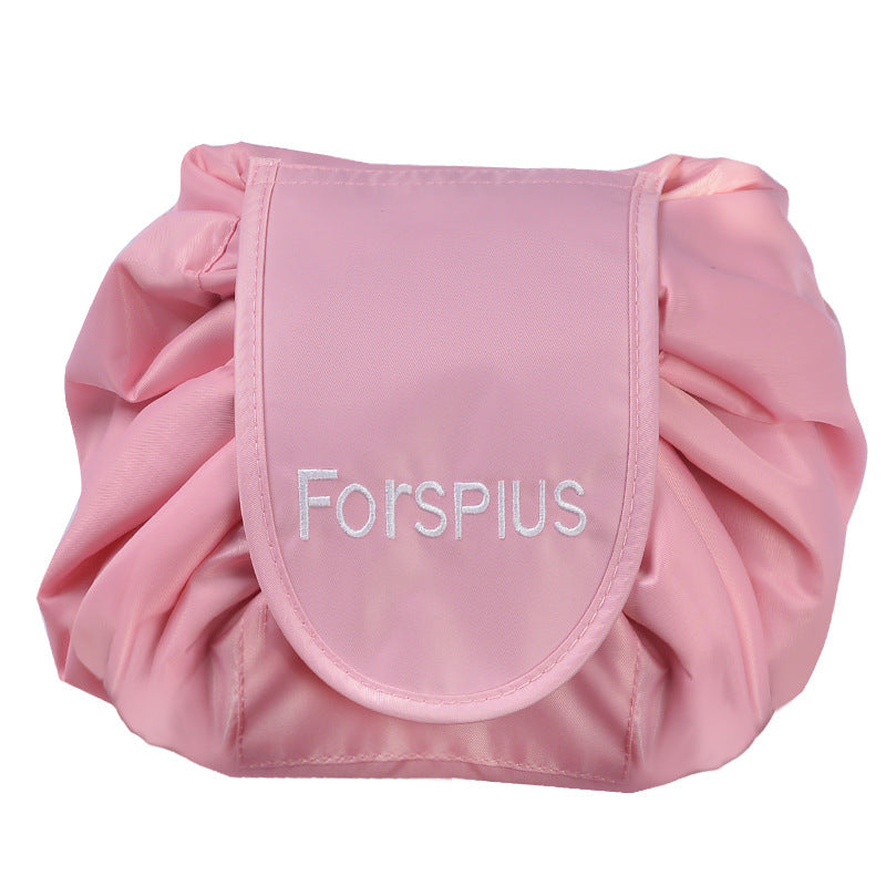 Pink waterproof drawstring toiletry bag with front pouch and ruched sides