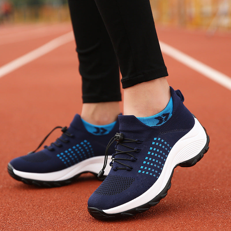 Women’s athletic knit sneaker in navy with light-blue side pattern and white sole