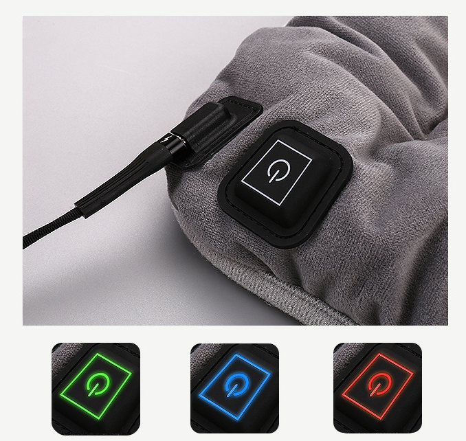 Grey heating pad controller with power button and cable, glowing light ring