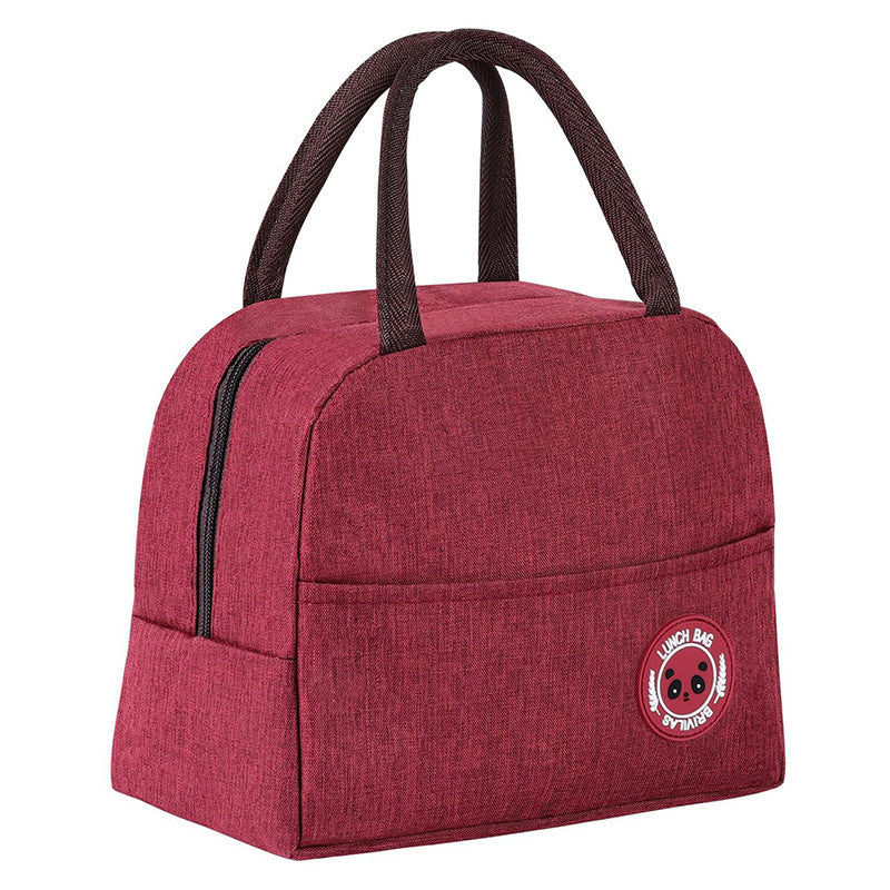 Pink insulated lunch bag with double handles and round bear logo patch on the front.