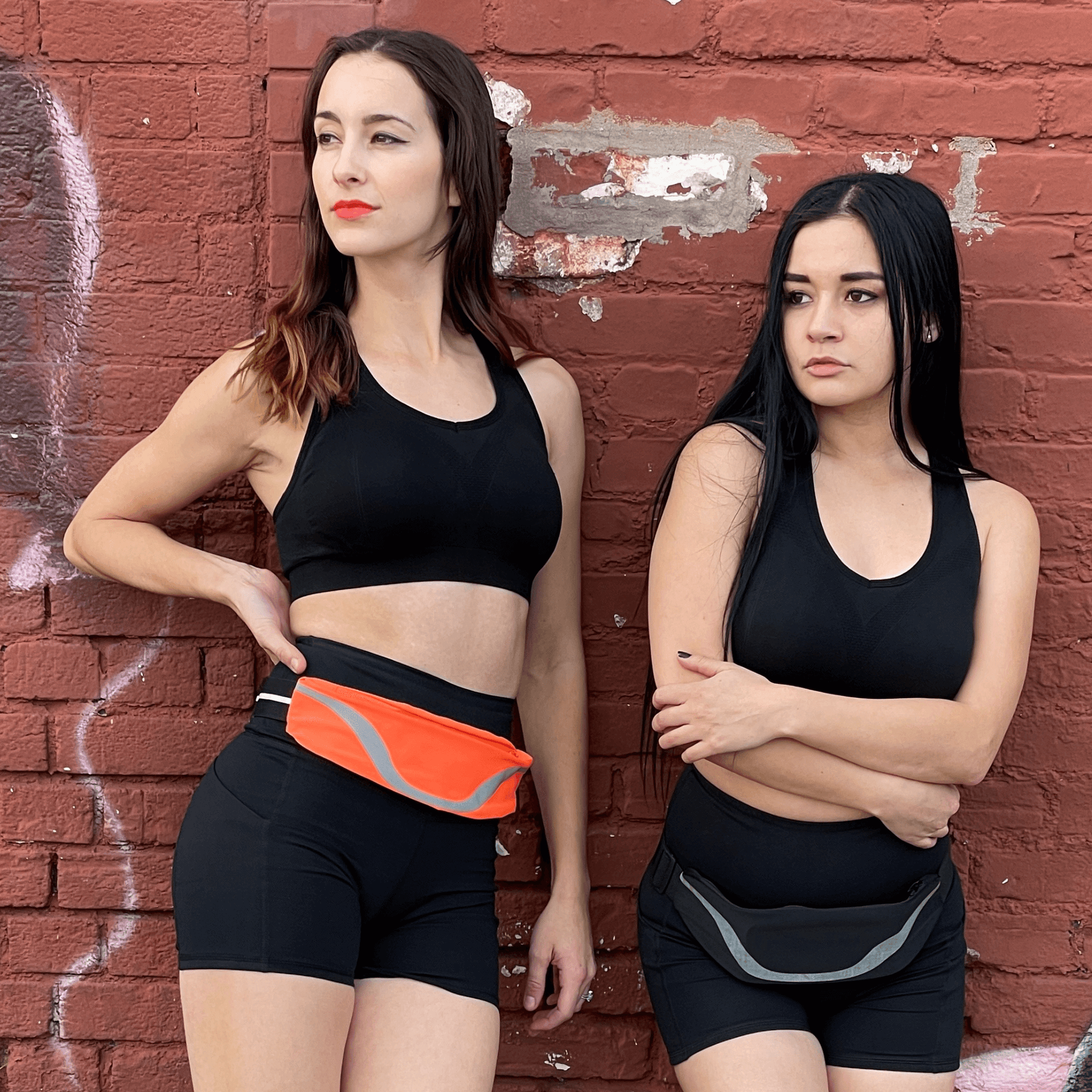 Water-resistant sport waist pack with gray reflective stripe, worn at the waist in orange color.