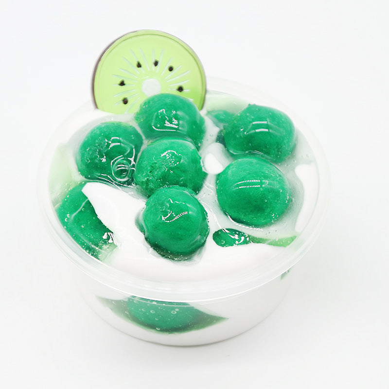 Lollipop slime in clear cup with green slime chunks and green topper
