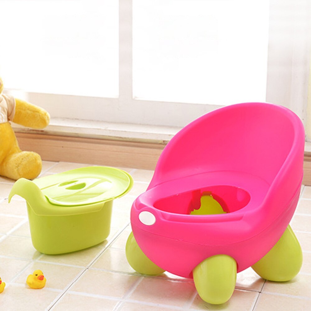 Kids cartoon potty stool in bright pink with lime-green legs and molded seat insert
