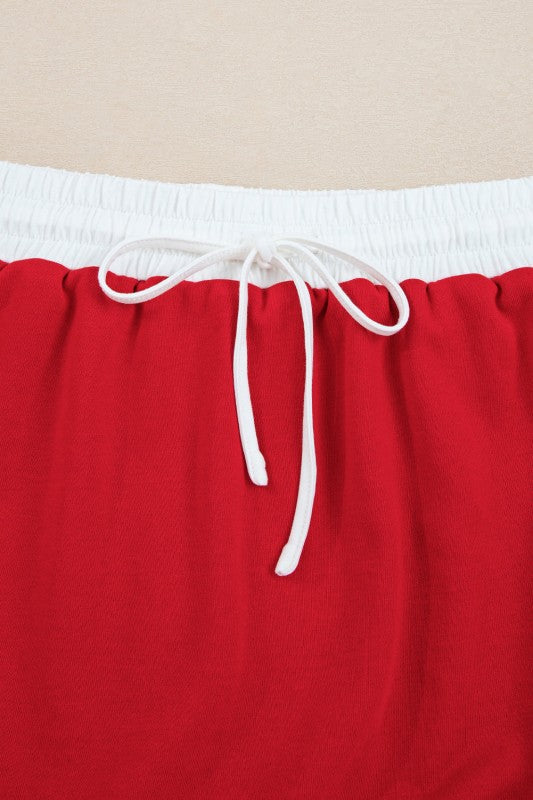 Red mini skirt with elastic waistband and white drawstring ties